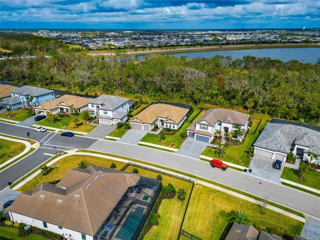 birds eye view of property featuring a water view