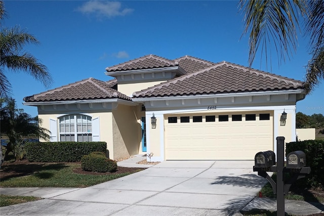 mediterranean / spanish-style house with a garage