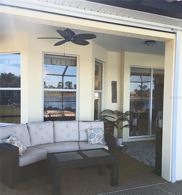 exterior space featuring ceiling fan