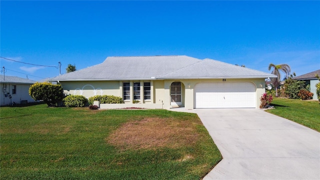 single story home featuring a garage and a front lawn