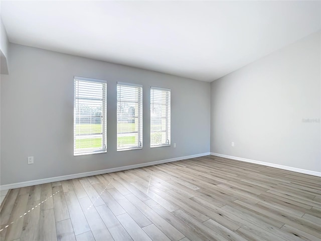 unfurnished room featuring light wood-type flooring