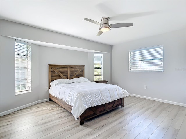 bedroom featuring light hardwood / wood-style floors and ceiling fan