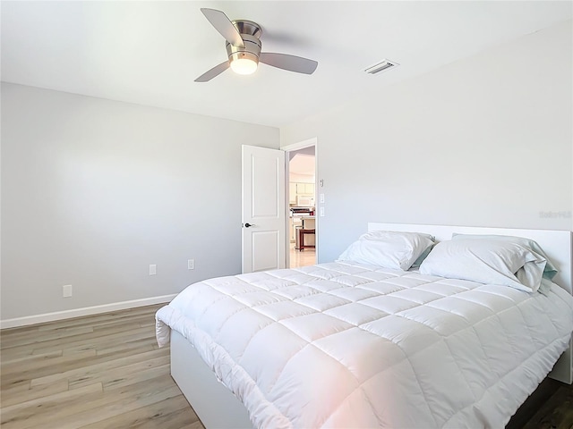 bedroom featuring ceiling fan and light hardwood / wood-style floors