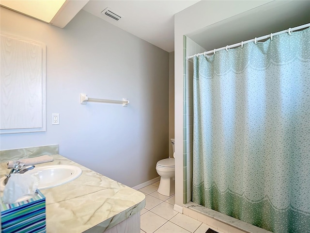 bathroom with tile patterned flooring, vanity, walk in shower, and toilet