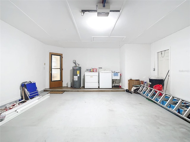 garage with water heater, washing machine and dryer, and sink