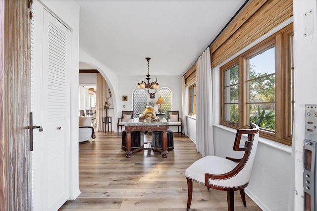 interior space with hardwood / wood-style floors and a notable chandelier