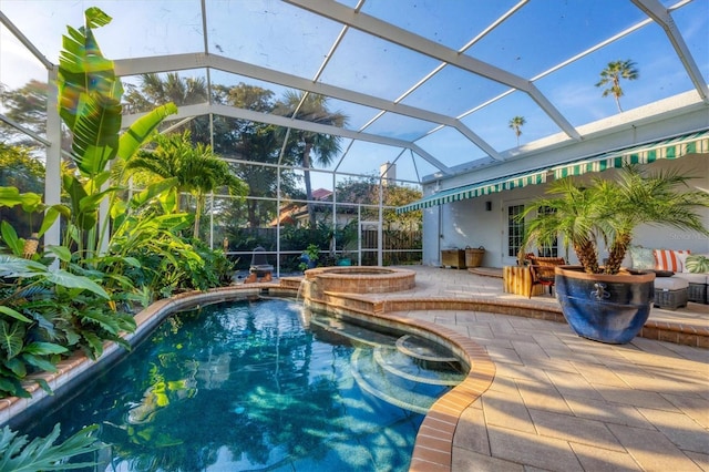 view of swimming pool with an in ground hot tub, glass enclosure, and a patio