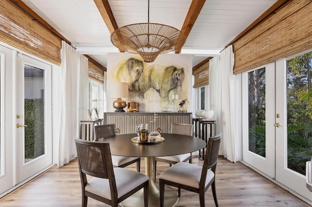 sunroom with beamed ceiling and french doors