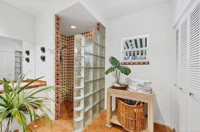 bathroom with walk in shower and tile patterned floors