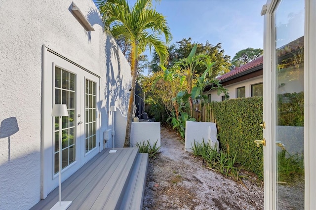 view of side of property with french doors