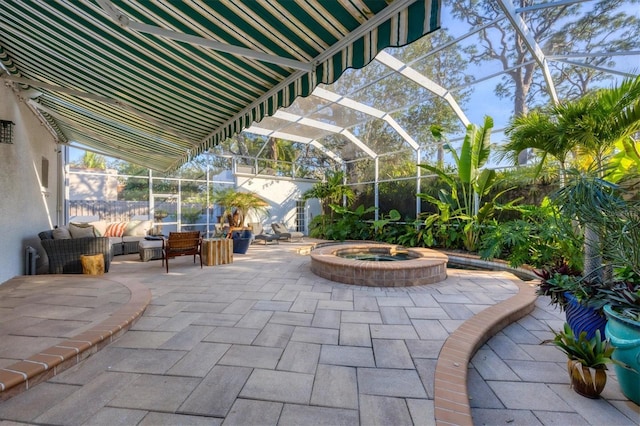 view of patio / terrace with an in ground hot tub, outdoor lounge area, and a lanai