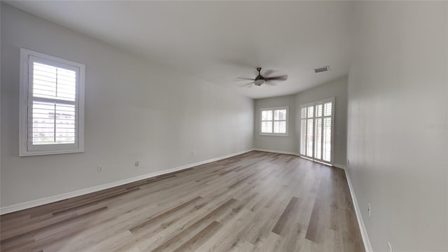 spare room featuring ceiling fan and light wood-type flooring