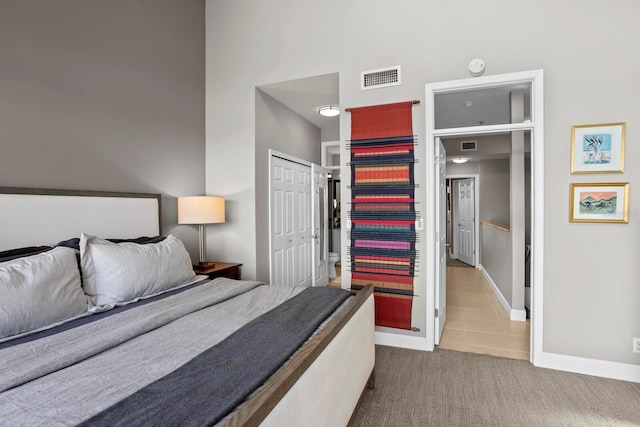 423 Bahia Beach Blvd, Ruskin, FL 33570 - tiled bedroom with baseboards and carpet flooring