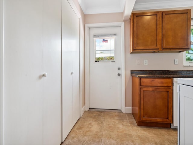 kitchen featuring ornamental molding and light tile patterned flooring