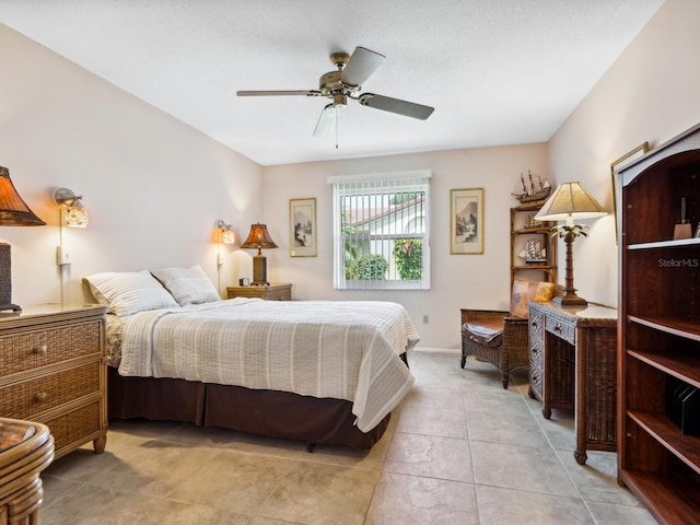 bedroom with light tile patterned flooring and ceiling fan