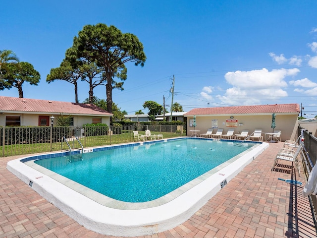 view of swimming pool with a patio area