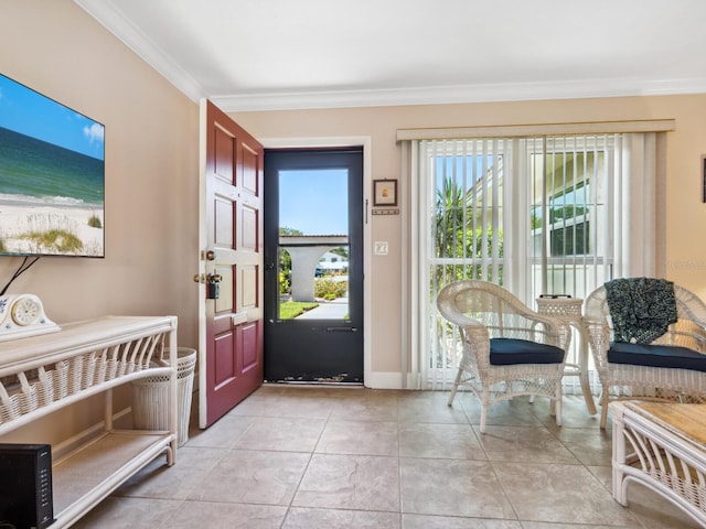 entrance foyer with ornamental molding and light tile patterned flooring