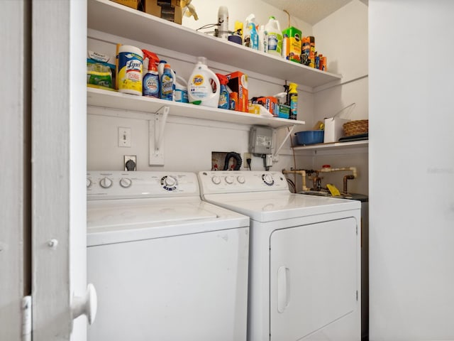 washroom featuring washer and clothes dryer