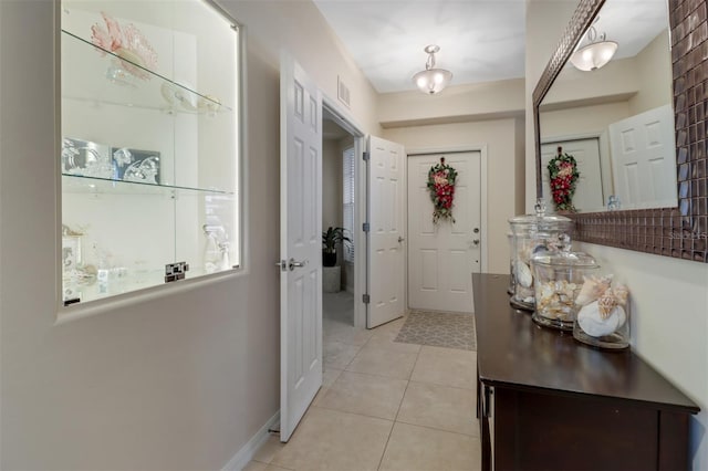 entryway featuring light tile patterned flooring