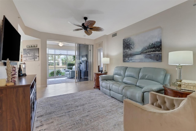 living room with light tile patterned floors and ceiling fan