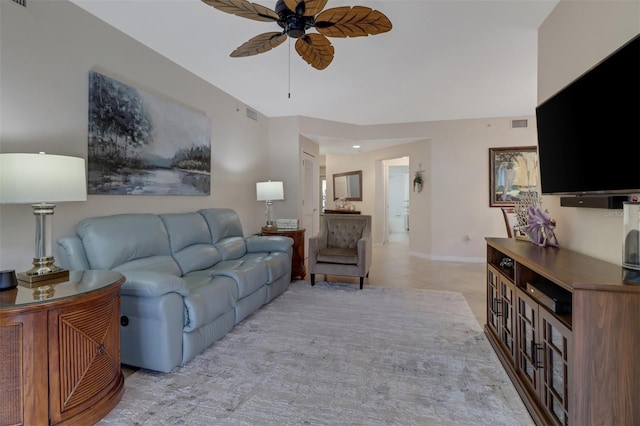 living room featuring light tile patterned flooring and ceiling fan