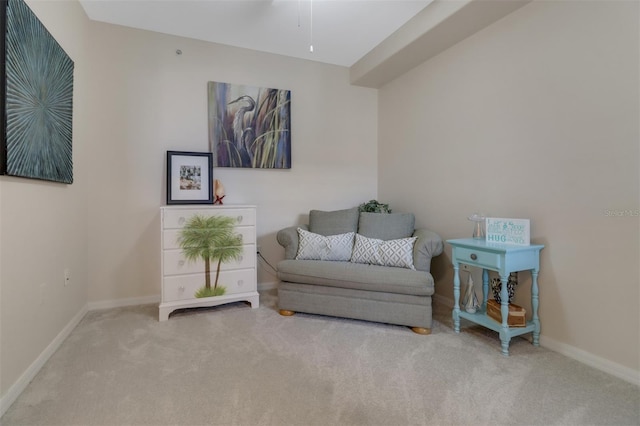 living area featuring carpet flooring