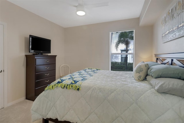 bedroom with ceiling fan and light carpet