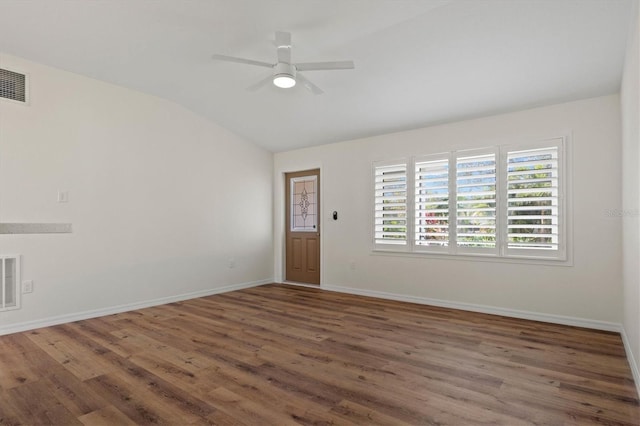 unfurnished room featuring dark wood-type flooring, vaulted ceiling, and ceiling fan