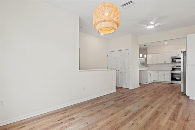 interior space with ceiling fan and light wood-type flooring