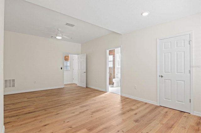 empty room featuring ceiling fan and light wood-type flooring