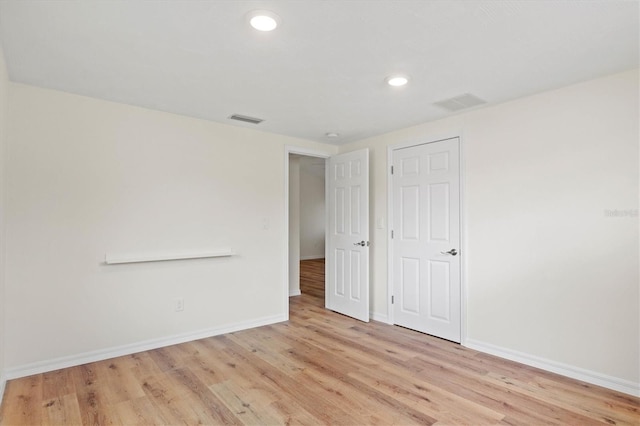 empty room featuring light hardwood / wood-style floors