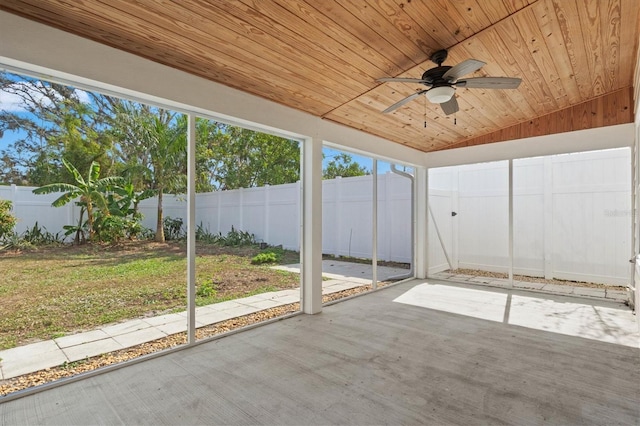 unfurnished sunroom featuring wood ceiling, ceiling fan, and lofted ceiling