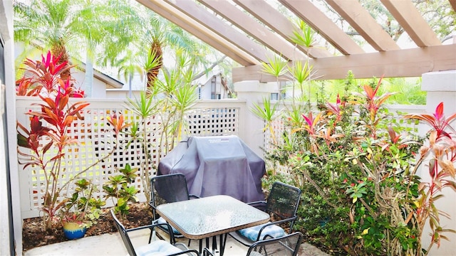 view of patio with a pergola and grilling area