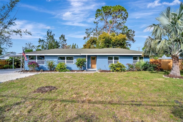 ranch-style home with a front lawn