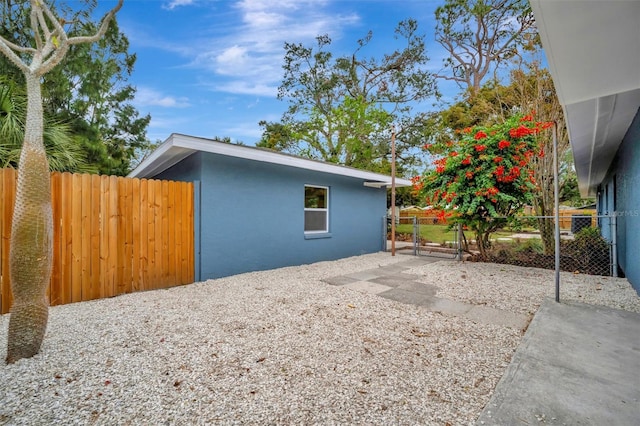 view of side of property with a patio