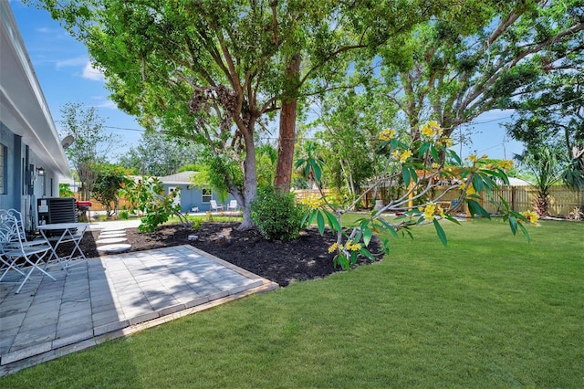view of yard with a patio area, central air condition unit, and a playground
