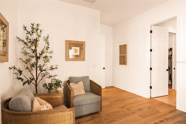 sitting room featuring light wood-style floors and baseboards