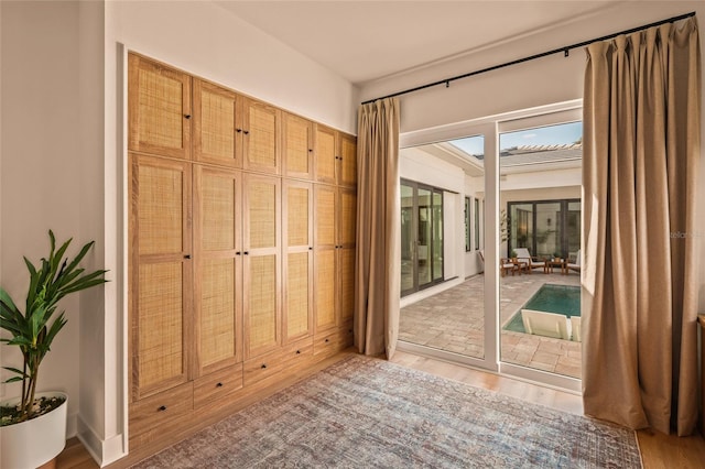 entryway with light wood-style floors