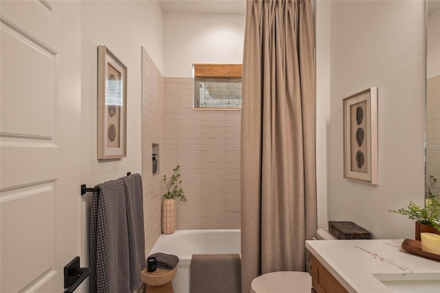 full bathroom featuring toilet, shower / tub combo with curtain, and vanity