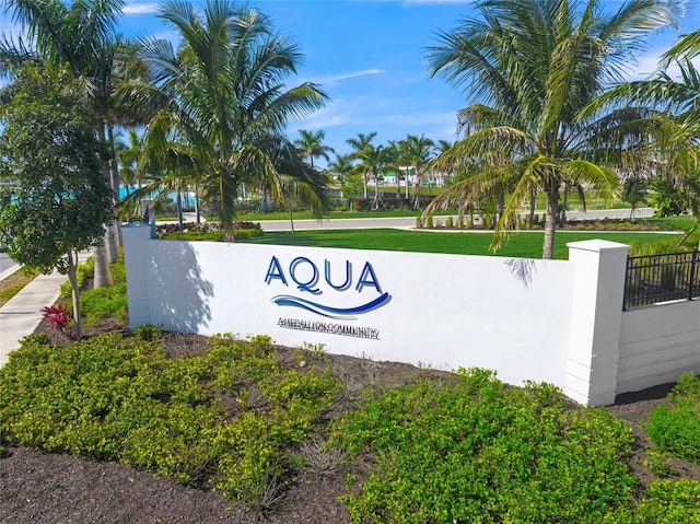 community sign featuring fence