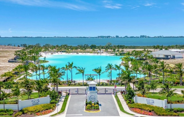 birds eye view of property with a water view