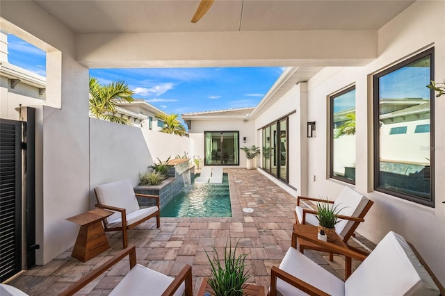 view of patio featuring fence and a fenced in pool