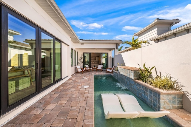 view of pool featuring a fenced in pool, fence, and a patio