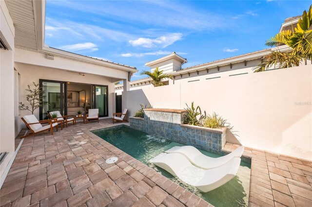 view of swimming pool with a patio, a fenced backyard, and a fenced in pool