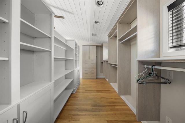 walk in closet featuring light hardwood / wood-style floors