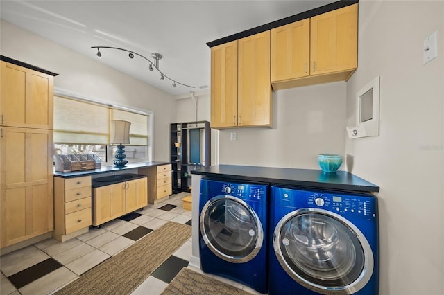 clothes washing area with cabinets, independent washer and dryer, rail lighting, and light tile patterned floors