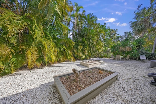 view of home's community with a patio area