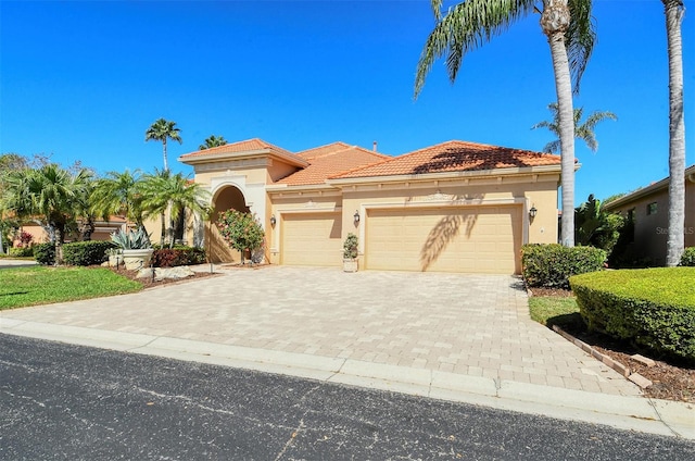 mediterranean / spanish-style house featuring a garage