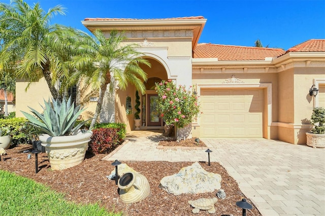 mediterranean / spanish-style home featuring a garage