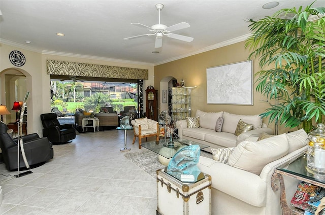 living room featuring light tile patterned floors, ornamental molding, and ceiling fan